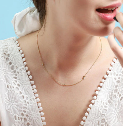 Gold 3 Stone Sideswept Initial Necklace